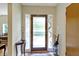 Welcoming entryway with decorative glass front door, console table, and blue and white umbrella stand at 14 Kessler Blvd W Dr, Indianapolis, IN 46208