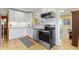 Beautiful kitchen boasts stainless steel appliances and white cabinetry at 14 Kessler Blvd W Dr, Indianapolis, IN 46208