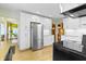 Modern kitchen features white cabinets and stainless steel appliances at 14 Kessler Blvd W Dr, Indianapolis, IN 46208