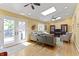 Cozy living room with skylights, hardwood floors, and a comfortable seating area with natural light at 14 Kessler Blvd W Dr, Indianapolis, IN 46208