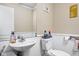 Compact bathroom with a pedestal sink, toilet, and wainscoting for a neat, tidy feel at 1657 10Th St, Danville, IN 46122