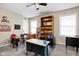 Bedroom featuring multiple study desks, shelves, and two windows at 1657 10Th St, Danville, IN 46122