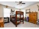 Cozy bedroom with a bunk bed, ceiling fan, and ample natural light from the windows at 1657 10Th St, Danville, IN 46122