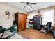 Bedroom featuring wood floors, multiple armoires for storage, and natural light from two windows at 1657 10Th St, Danville, IN 46122