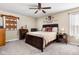 Bedroom with a queen-size bed, wooden furniture, and soft carpet flooring creating a relaxing space at 1657 10Th St, Danville, IN 46122