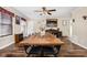 Bright dining room features a rustic wooden table, hardwood floors, and ample space for Gathering and guests to enjoy at 1657 10Th St, Danville, IN 46122