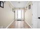 Bright foyer with neutral walls, tile flooring, and a glass-paneled front door, creating a welcoming entry at 1657 10Th St, Danville, IN 46122