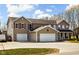 Spacious two-story home with an attached two-car garage and well-maintained lawn, showcasing classic suburban living at 1657 10Th St, Danville, IN 46122