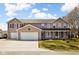 Inviting two-story home with a two-car garage, classic siding, and a cozy front porch with ample curb appeal at 1657 10Th St, Danville, IN 46122