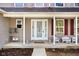 Welcoming front porch features cozy seating, decorative details, and an inviting entrance to the home at 1657 10Th St, Danville, IN 46122