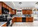 Bright kitchen featuring stainless appliances, granite countertops, and ample cabinet space at 1657 10Th St, Danville, IN 46122