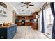 Open kitchen featuring tile flooring, dark wooden cabinets, and a breakfast bar area at 1657 10Th St, Danville, IN 46122