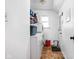 Efficient laundry room with washer, dryer, and storage shelves for convenience at 1657 10Th St, Danville, IN 46122