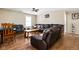 Inviting living room featuring hardwood floors, a large leather sectional, and natural light at 1657 10Th St, Danville, IN 46122