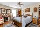 Charming main bedroom featuring a wooden bedframe, hardwood floors, and natural light at 1657 10Th St, Danville, IN 46122