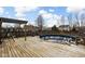 Backyard features a pool with a wooden deck, swing, and slide, perfect for outdoor enjoyment and relaxation at 1657 10Th St, Danville, IN 46122