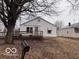 Charming single-story home featuring a wooden porch, a mailbox, and a well-maintained lawn at 1900 E Purdue Rd, Muncie, IN 47303
