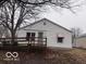 Cozy single-story home with a welcoming deck, mature tree, and a classic, neutral-toned exterior at 1900 E Purdue Rd, Muncie, IN 47303