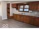Traditional kitchen with wood cabinets and a countertop, offering ample storage at 1900 E Purdue Rd, Muncie, IN 47303