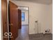Functional laundry area with modern flooring, ready for appliances and daily tasks at 1900 E Purdue Rd, Muncie, IN 47303