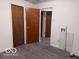 Bright laundry area with durable flooring and convenient access to adjacent rooms at 1900 E Purdue Rd, Muncie, IN 47303