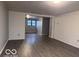 Open-plan living room features durable flooring, perfect for any style of decor and furniture at 1900 E Purdue Rd, Muncie, IN 47303