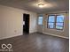 The inviting living room features durable floors, providing a cozy and functional space at 1900 E Purdue Rd, Muncie, IN 47303