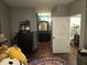 Bedroom view showcasing an open bathroom, dark dresser and closet at 2121 Grenville St # Apt 2A, Carmel, IN 46032