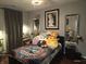 Cozy bedroom featuring a decorative duvet, plush pillows, and soft lighting, creating a relaxing atmosphere at 2121 Grenville St # Apt 2A, Carmel, IN 46032