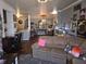 Open-concept living room with comfortable seating, adjacent to a modern kitchen and dining area at 2121 Grenville St # Apt 2A, Carmel, IN 46032