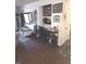 Open-concept living area with modern furniture, a built-in bookcase, and stylish decor at 2121 Grenville St # Apt 2A, Carmel, IN 46032
