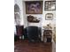 Office space showcasing a dark wood desk with a rolling chair and unique decor accents at 2121 Grenville St # Apt 2A, Carmel, IN 46032