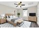 Cozy main bedroom featuring a ceiling fan, a large window, and an ensuite closet at 2184 Galaxy Dr, Franklin, IN 46131