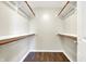 This walk-in closet includes wood floors and wood shelving at 2184 Galaxy Dr, Franklin, IN 46131