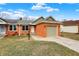 Charming brick home featuring an attached garage and a well-maintained front yard at 2184 Galaxy Dr, Franklin, IN 46131