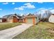 Charming brick home featuring an attached garage and a well-maintained front yard at 2184 Galaxy Dr, Franklin, IN 46131