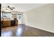 Spacious eat-in kitchen with wood cabinets, black appliances, and wood-look floors at 2184 Galaxy Dr, Franklin, IN 46131