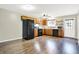 Spacious eat-in kitchen with wood cabinets, black appliances, wood-look floors, and a ceiling fan at 2184 Galaxy Dr, Franklin, IN 46131