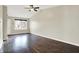 Bright living room featuring hardwood floors, a ceiling fan, and plenty of natural light at 2184 Galaxy Dr, Franklin, IN 46131