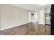 Open-concept living area with wood-look floors and neutral wall paint at 2184 Galaxy Dr, Franklin, IN 46131