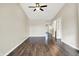 Bright living room featuring hardwood floors, a ceiling fan, and access to other rooms in the house at 2184 Galaxy Dr, Franklin, IN 46131