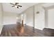 Bright living room featuring hardwood floors, a ceiling fan, and access to other rooms in the house at 2184 Galaxy Dr, Franklin, IN 46131