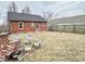 Expansive backyard with a brick firepit, seating, and plenty of open lawn space at 24 N Clay St, Mooresville, IN 46158