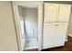 Bright entryway featuring tiled floors, white storage cabinets, and a front door at 24 N Clay St, Mooresville, IN 46158