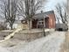Brick home featuring a front porch and updated landscaping at 24 N Clay St, Mooresville, IN 46158