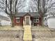 Charming brick home with a new front entrance and landscaping at 24 N Clay St, Mooresville, IN 46158
