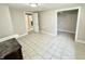 Open room with tiled floors, neutral walls, closet, and view into other rooms at 24 N Clay St, Mooresville, IN 46158