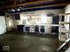 Garage featuring lots of shelving and work space at 2513 W 10Th St, Muncie, IN 47302