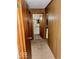 Hallway with wood paneling leading to a bathroom at 2513 W 10Th St, Muncie, IN 47302