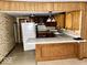 Kitchen featuring a breakfast bar and vintage cabinetry at 2513 W 10Th St, Muncie, IN 47302